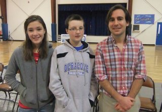 1st place winner Caroline Temple, 2nd place winner Dylan Sutton and teacher She Youell pose after the school Spelling Bee.